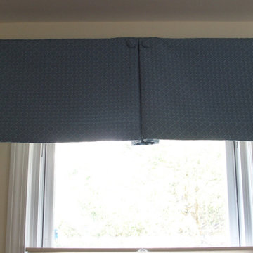 Box pleat valances enhanced with covered buttons in a quiet study