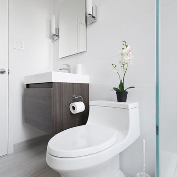Kohler Touchless Toilet And Fresca Vanity Against Glassos Tile