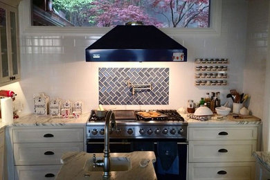 Example of a farmhouse kitchen design in Other with blue backsplash and subway tile backsplash