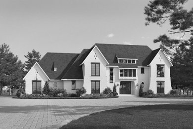 Example of a french country home design design in Raleigh