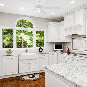 White raised panel kitchen with chocolate glaze