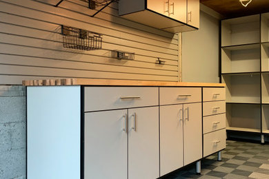 Example of a mid-sized trendy attached one-car garage design in New York