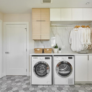 Inspiration for a medium sized scandinavian single-wall separated utility room in Vancouver with a submerged sink, flat-panel cabinets, white cabinets, engineered stone countertops, ceramic flooring, a side by side washer and dryer, white worktops, white walls and multi-coloured floors.