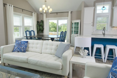 Design ideas for a mid-sized beach style open concept family room in DC Metro with vinyl floors.