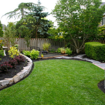 AFTER: Satellite patio and curved rock wall