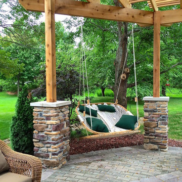 Cozy Swings Hangs from Cedar Pergola over Patio