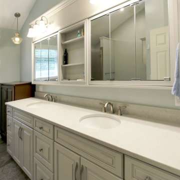 Warm Gray Vanity with Maple Truffle Accent Linen Cabinet and Tiled Shower