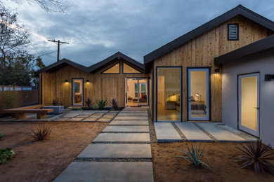 Inspiration for a country multicolored one-story wood house exterior remodel in Los Angeles with a shingle roof