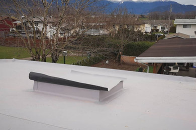Example of a large minimalist two-story exterior home design in Vancouver