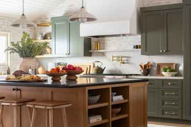 Transitional medium tone wood floor and shiplap ceiling eat-in kitchen photo in Orange County with a farmhouse sink, green cabinets, quartzite countertops, stainless steel appliances and an island