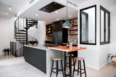 Inspiration for a contemporary single-wall eat-in kitchen in Adelaide with black cabinets, stainless steel appliances, ceramic floors, with island, grey floor, a single-bowl sink, flat-panel cabinets, multi-coloured splashback and grey benchtop.