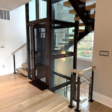 Project #136 | Modern Floating Staircase Encircling Glass Elevator