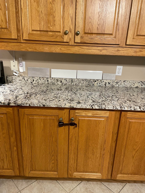 Changing cabinet color to match granite countertops!