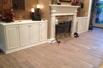 Living room - mid-sized transitional formal and enclosed light wood floor living room idea in Miami with brown walls, a standard fireplace and a tile fireplace