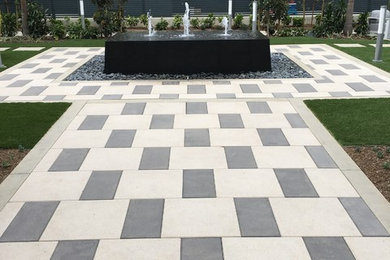 Inspiration for a contemporary drought-tolerant side yard concrete paver water fountain landscape in San Diego.