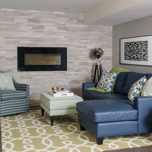 This is an example of a classic basement in Toronto with grey walls, dark hardwood flooring, a ribbon fireplace and a tiled fireplace surround.