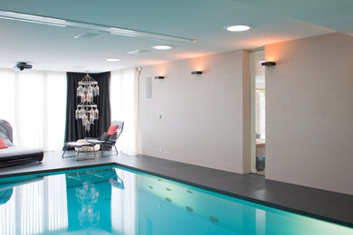 Inspiration for a contemporary pool remodel in Other