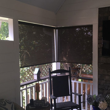 Sun block shades installed on screen porch
