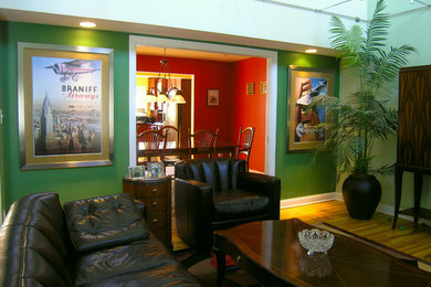 Game room - mid-sized contemporary enclosed medium tone wood floor game room idea in New York with multicolored walls, no fireplace and a concealed tv