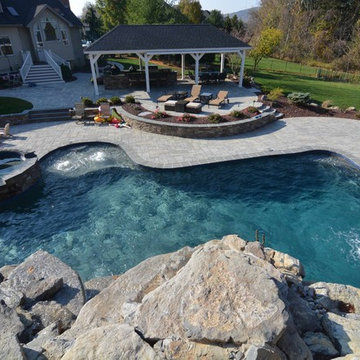 Custom Freeform style salt water in ground pool with Waterslide and Spa