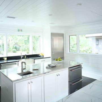 Kitchen featuring two sinks and double islands