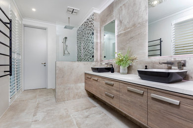 Photo of a contemporary master bathroom in Perth with flat-panel cabinets, white cabinets, a corner shower, a two-piece toilet, beige tile, ceramic tile, beige walls, ceramic floors, a vessel sink, engineered quartz benchtops, beige floor, an open shower, white benchtops, an enclosed toilet, a double vanity and a built-in vanity.