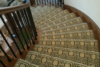 Example of a mid-sized trendy carpeted curved staircase design in Denver with wooden risers