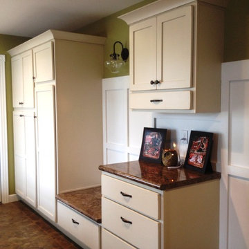 The broom closet and locker area keep items out of sight. Love the seat to put