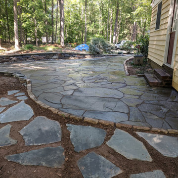 Large Irregular Bluestone Patio, Seating Wall, and Walkways Plus In Laid Design