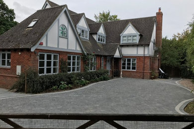 This is an example of a contemporary garden in Hampshire with concrete pavers.