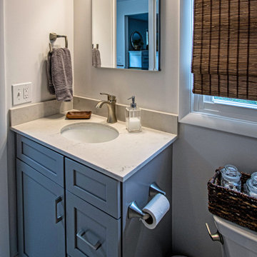 Gray Bathroom with Tiled Shower and Make-Up Area