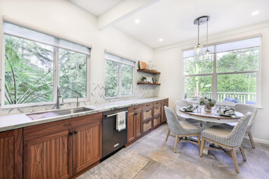Example of a mid-sized beach style slate floor eat-in kitchen design in San Francisco with a single-bowl sink, shaker cabinets, medium tone wood cabinets, quartzite countertops, blue backsplash, mosaic tile backsplash and black appliances