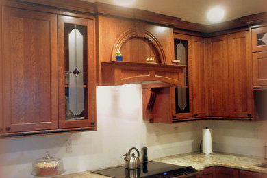 Design ideas for a mid-sized arts and crafts u-shaped eat-in kitchen in Other with an undermount sink, flat-panel cabinets, medium wood cabinets, granite benchtops and ceramic floors.