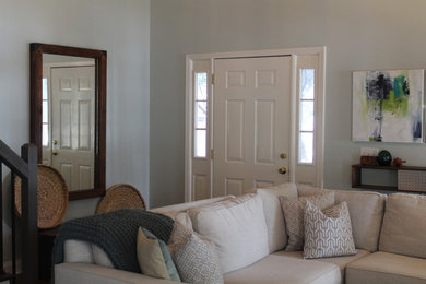 Example of a mid-sized arts and crafts dark wood floor and brown floor entryway design in Atlanta with a white front door and white walls