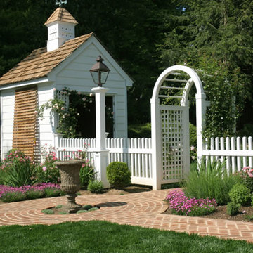 Arched Rose Trellis and White Picket Fence