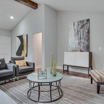 Light-Filled Living Room with Custom Beam