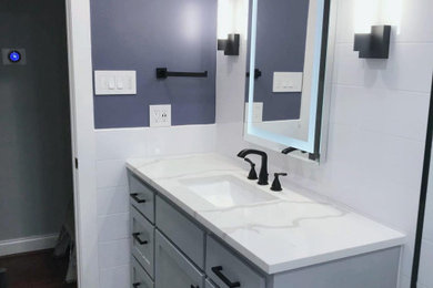 Example of a small transitional 3/4 white tile and ceramic tile porcelain tile, gray floor, single-sink and wainscoting bathroom design in Dallas with shaker cabinets, gray cabinets, a two-piece toilet, blue walls, an undermount sink, quartzite countertops, white countertops and a freestanding vanity