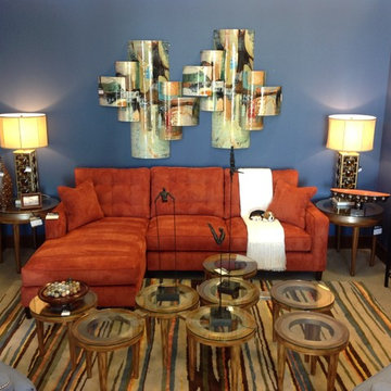 Blue family room with Orange sofa