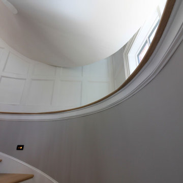 Project #95 | Freestanding Elliptical Staircase with Geometric Iron Balusters