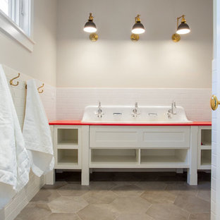 Example of a mid-sized trendy kids' white tile and subway tile bathroom design in Salt Lake City with open cabinets, white cabinets, a trough sink, solid surface countertops and red countertops