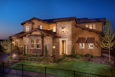 Example of a tuscan exterior home design in Denver