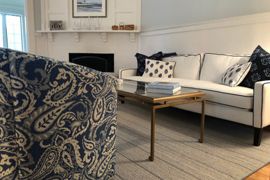 Mid-sized transitional formal light wood floor and blue floor living room photo in Boston with blue walls, a corner fireplace, a wood fireplace surround and no tv