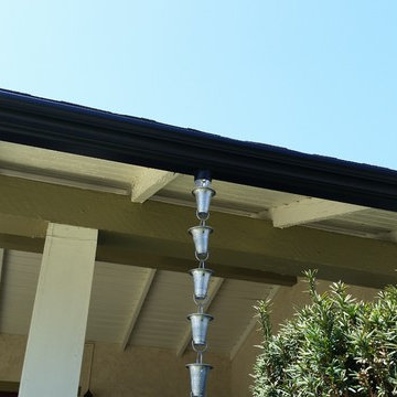 Triple Curve Rain Gutter in Black Aluminum.