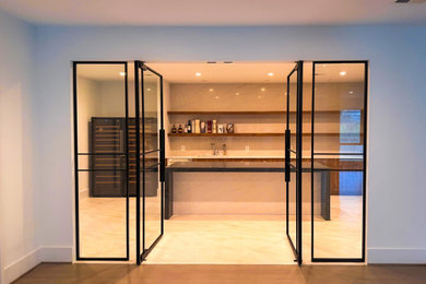 Inspiration for a modern basement remodel in DC Metro with a bar