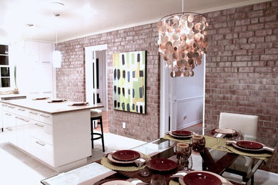 Example of a mid-sized trendy l-shaped eat-in kitchen design in DC Metro with flat-panel cabinets, white cabinets, stainless steel appliances and an island