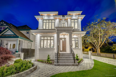 Large modern beige three-story mixed siding exterior home idea in Vancouver with a shingle roof