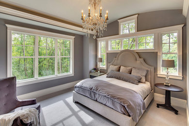 Large transitional master carpeted and gray floor bedroom photo in New York with gray walls and no fireplace
