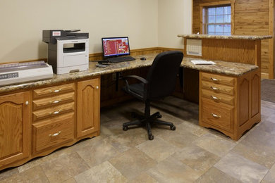 Example of a mid-sized classic built-in desk ceramic tile and beige floor study room design in Other with white walls