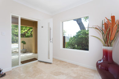 Photo of a contemporary entryway in Perth with travertine floors.