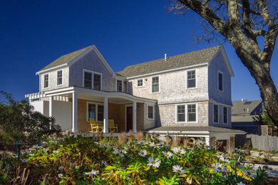 Inspiration for a mid-sized coastal three-story wood gable roof remodel in Boston